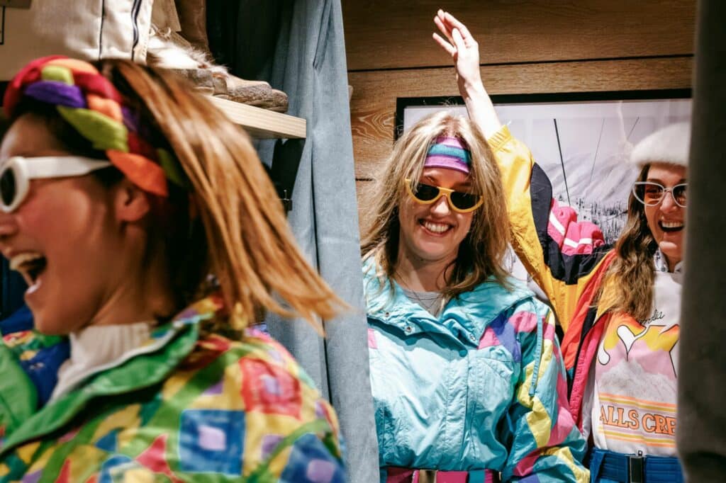Group of people trying on vintage snow outfits at Falls Creek Alpine Resort at I Dream of Snow