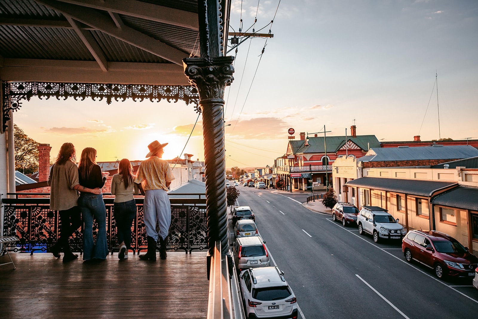Group of people enjoying sunset views over Rutherglen main street.