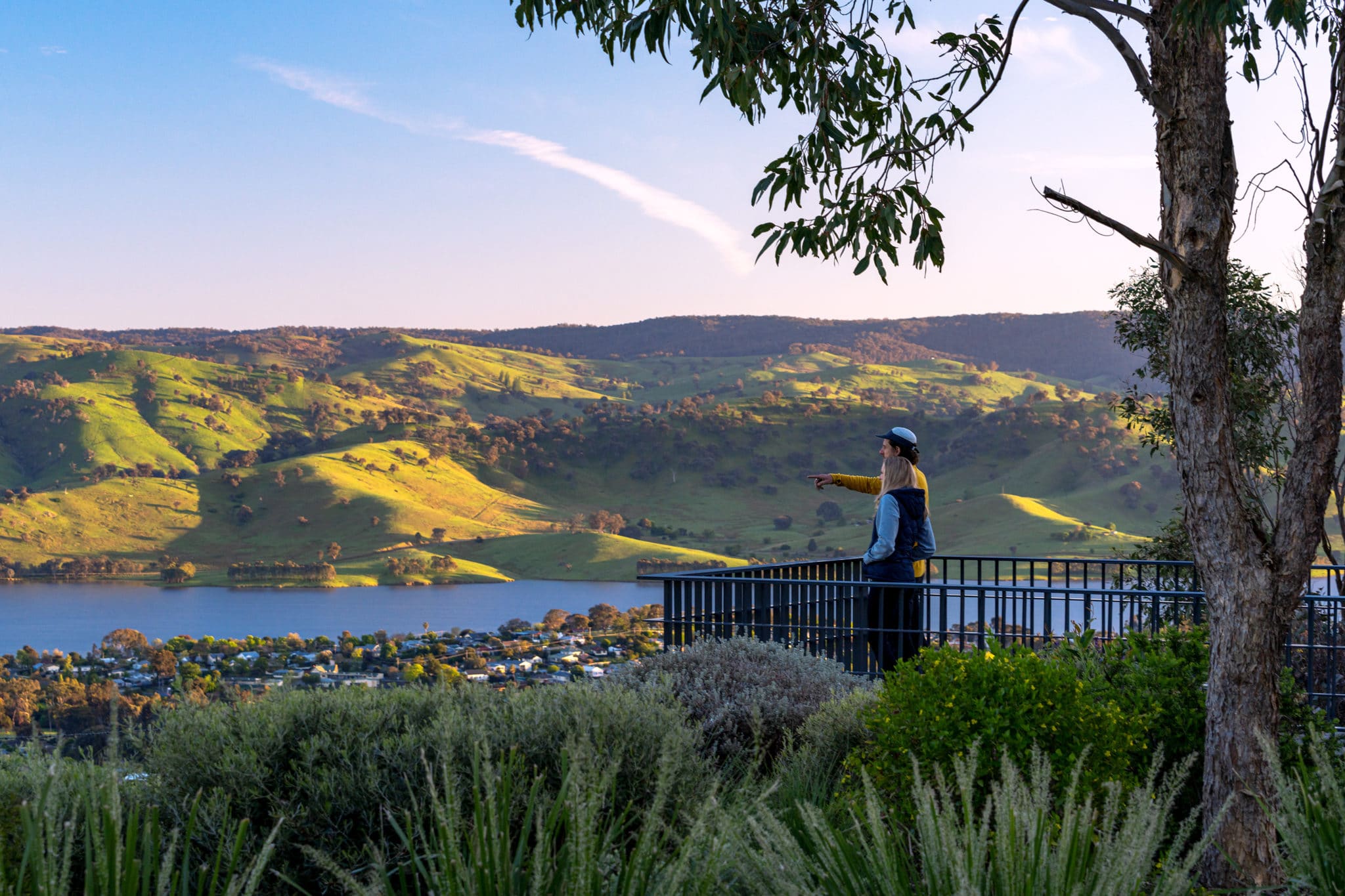 A couple taking in views of Lake Hume at the Tallangatta Lookout
