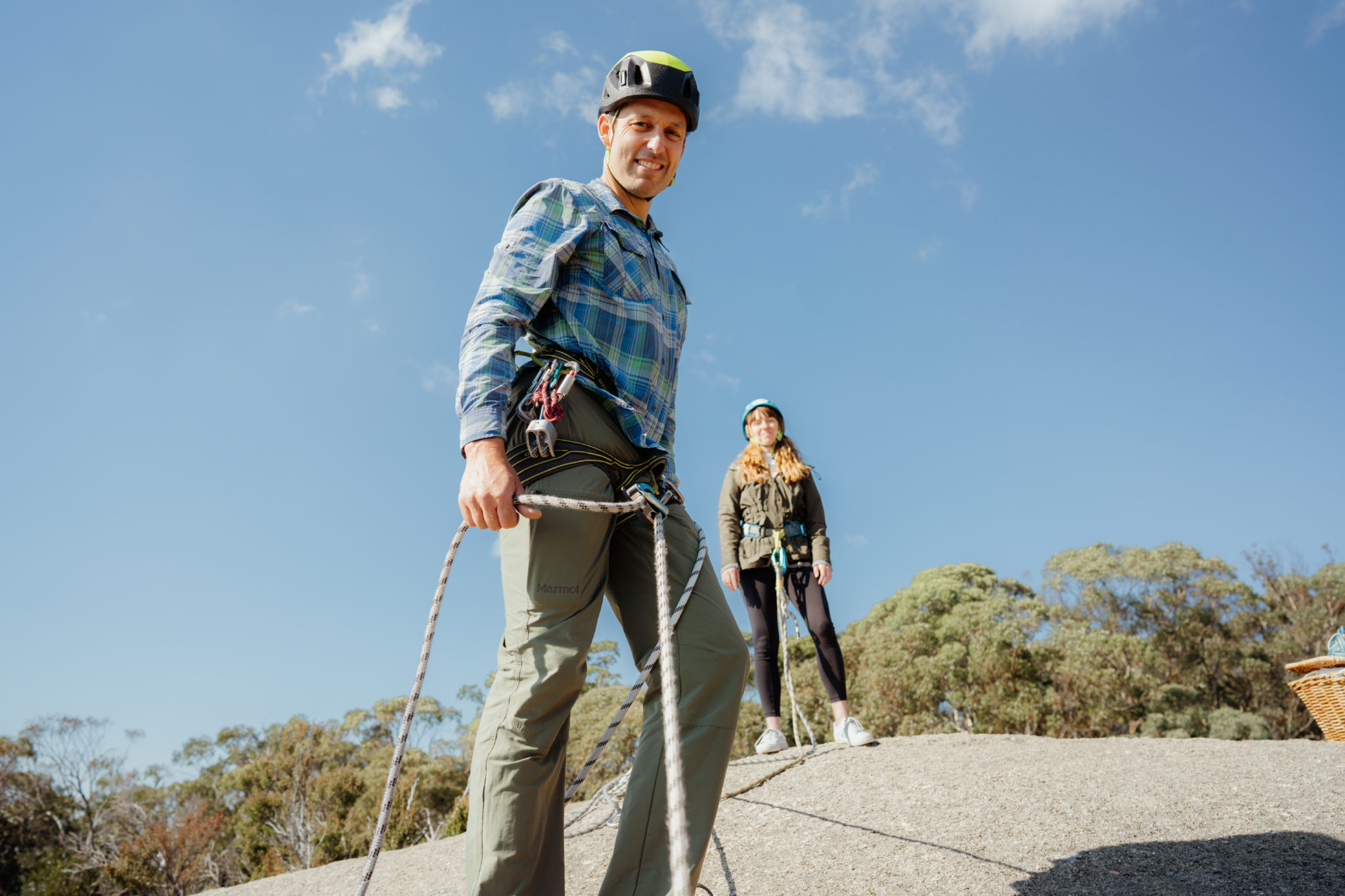 POV, An abseiling instructor smiling at abseiler on Mt Buffalo