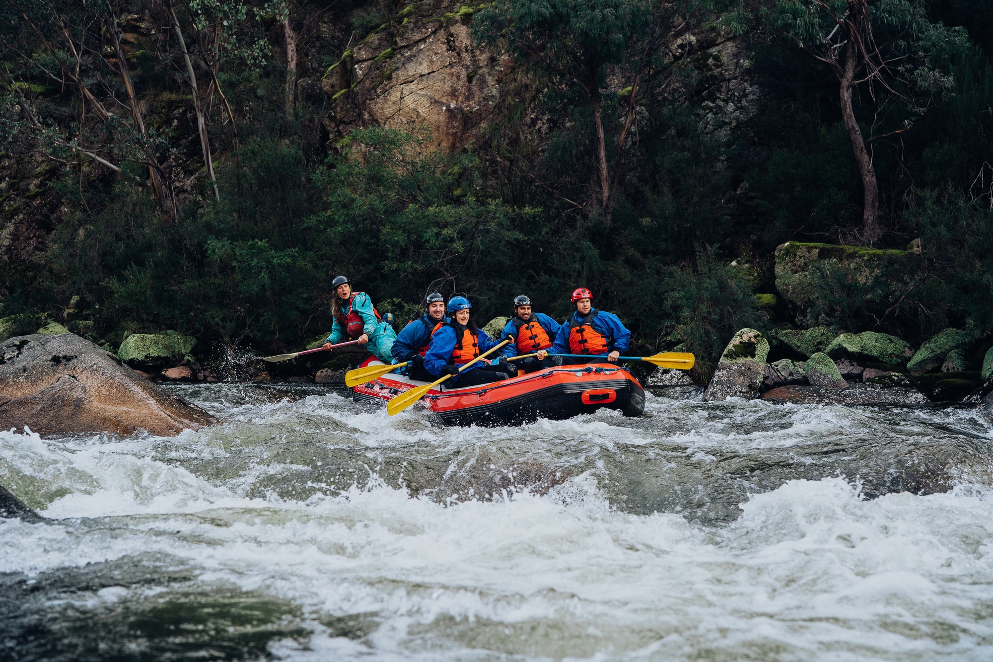 Group white water rafting in Mitta MItta with pristine wilderness in the background