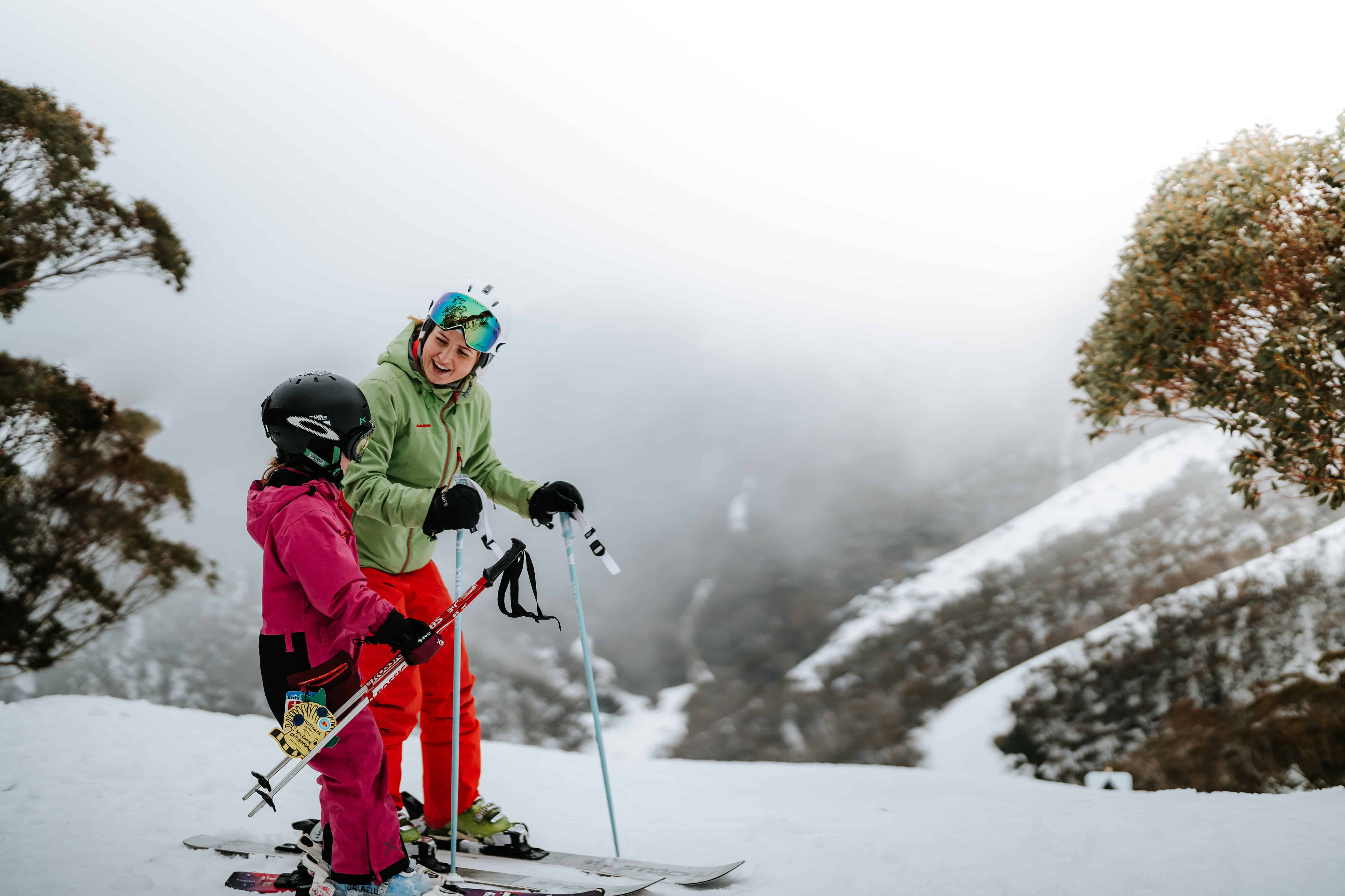 A MOTHER AND CHILD SKIING ON MT HOTHAM