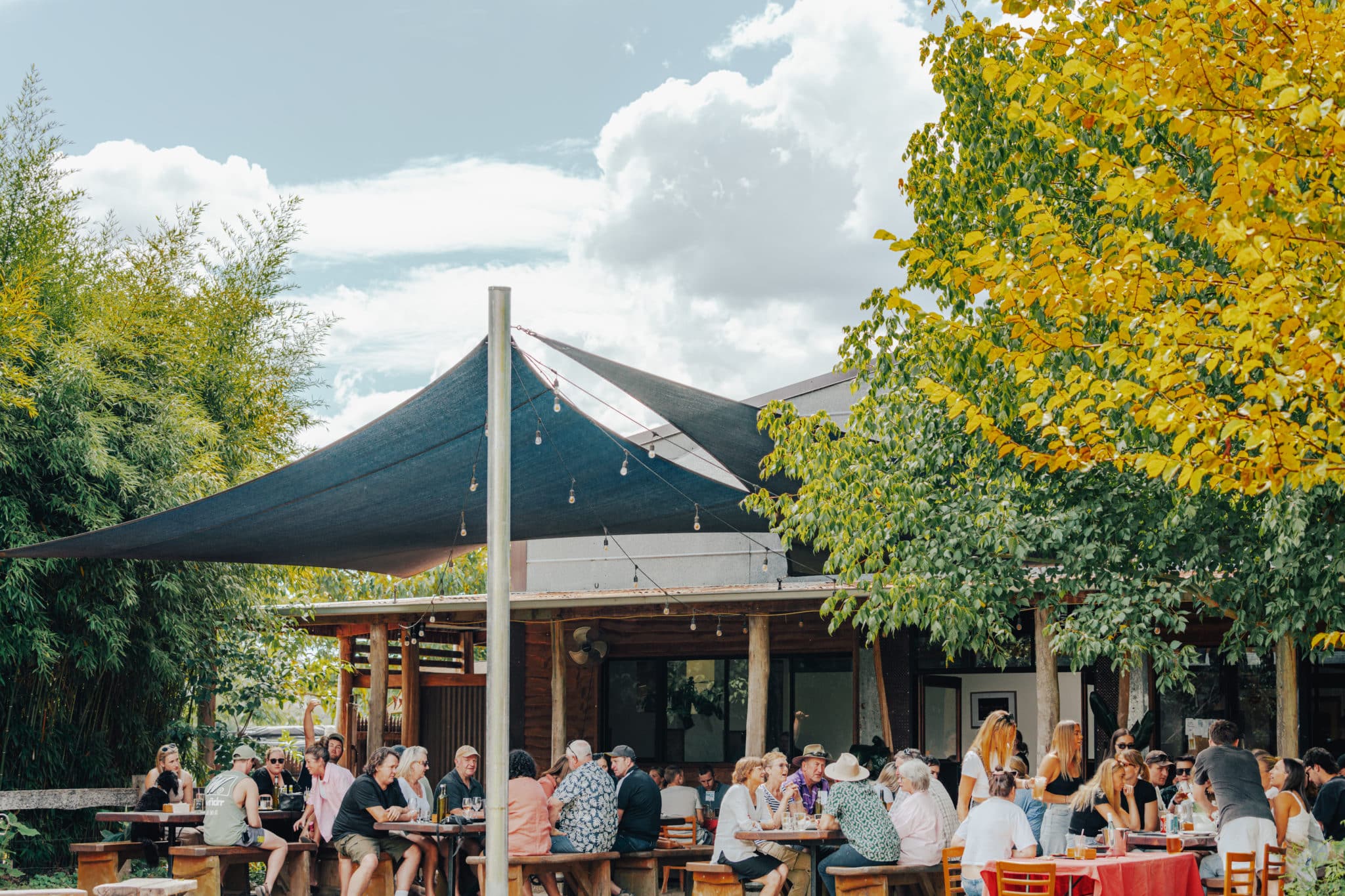 A crowd enjoying the autumn afternoon in the beer garden at Mitta Brewery.