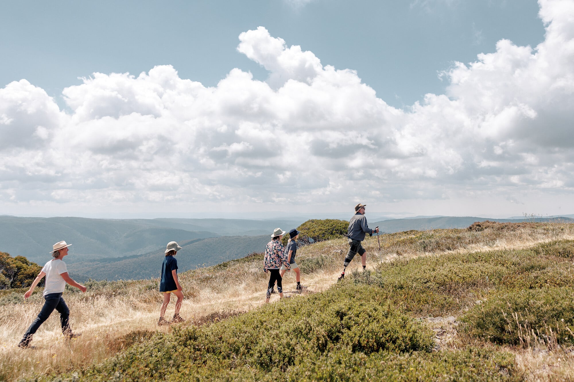 Family walking through the Mt Hotham landscape on an accessible adventure
