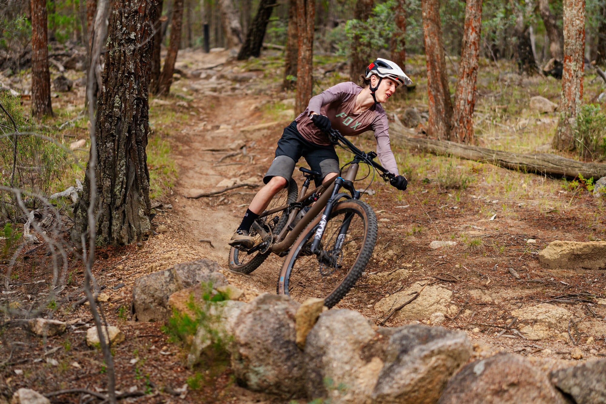 Mountain biker riding Beechworth Mountain Bike Park trails technical granite features