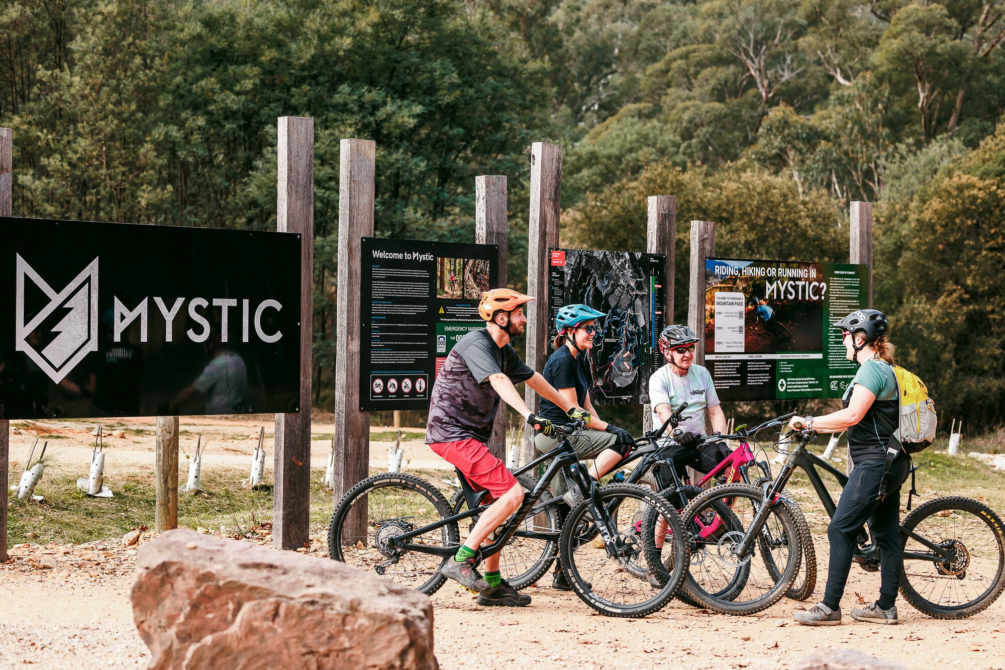 Group of cyclists at Mystic Bike Park's trailhead on a RideCraft guided ride