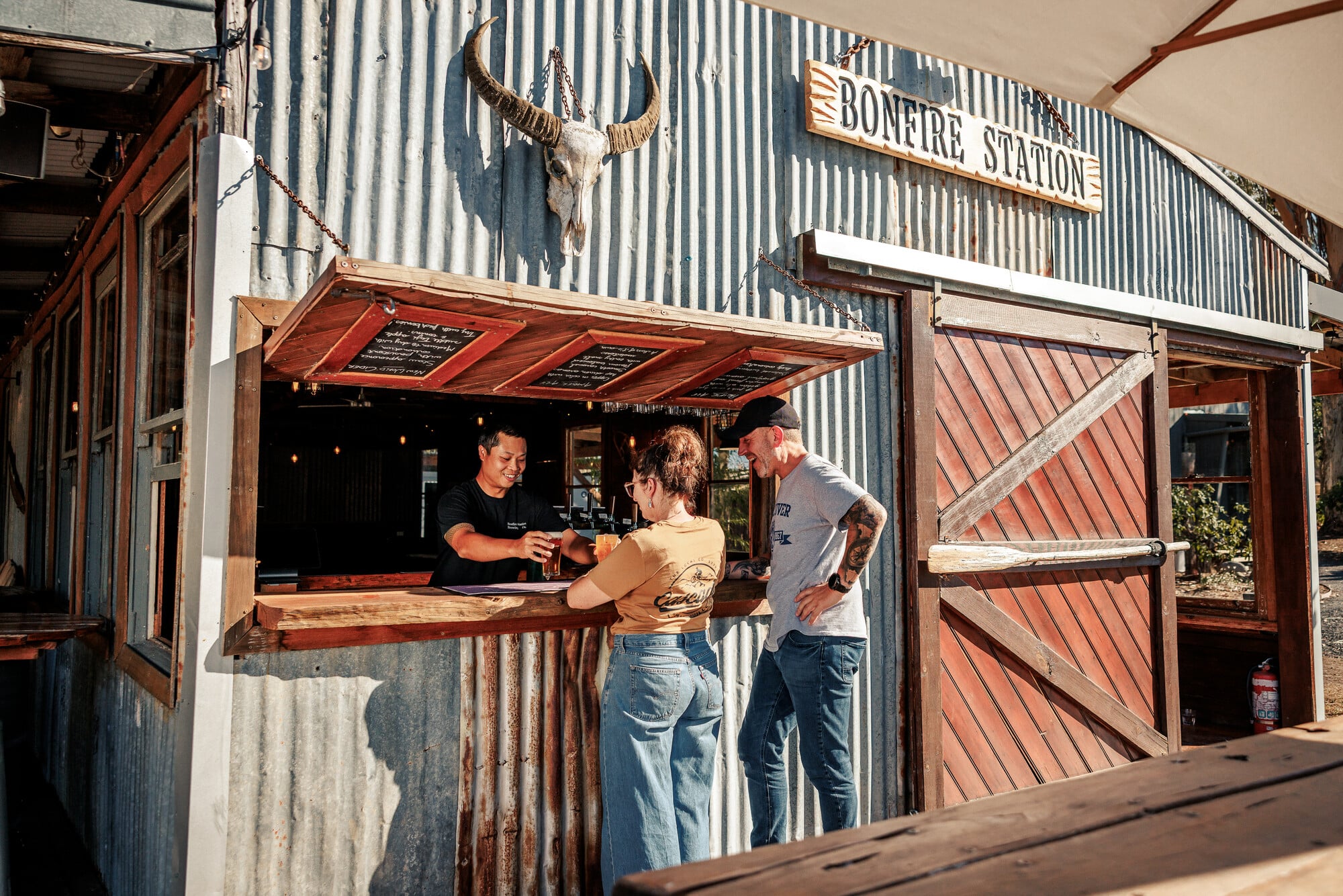 Two people ordering beers at Bonfire Station near Marysville