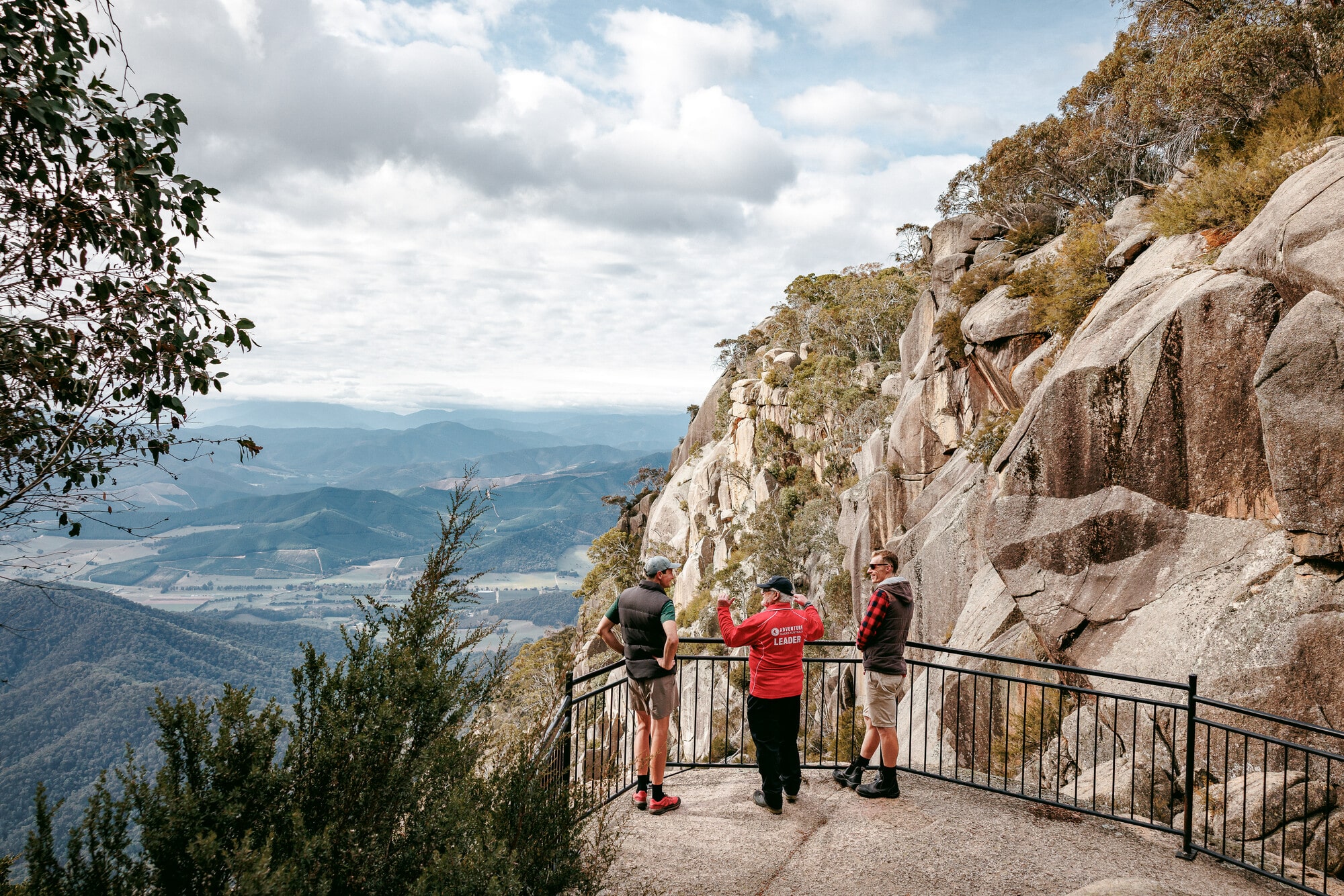 Group looking at mountain views at a Mount Buffalo lookout on a hike