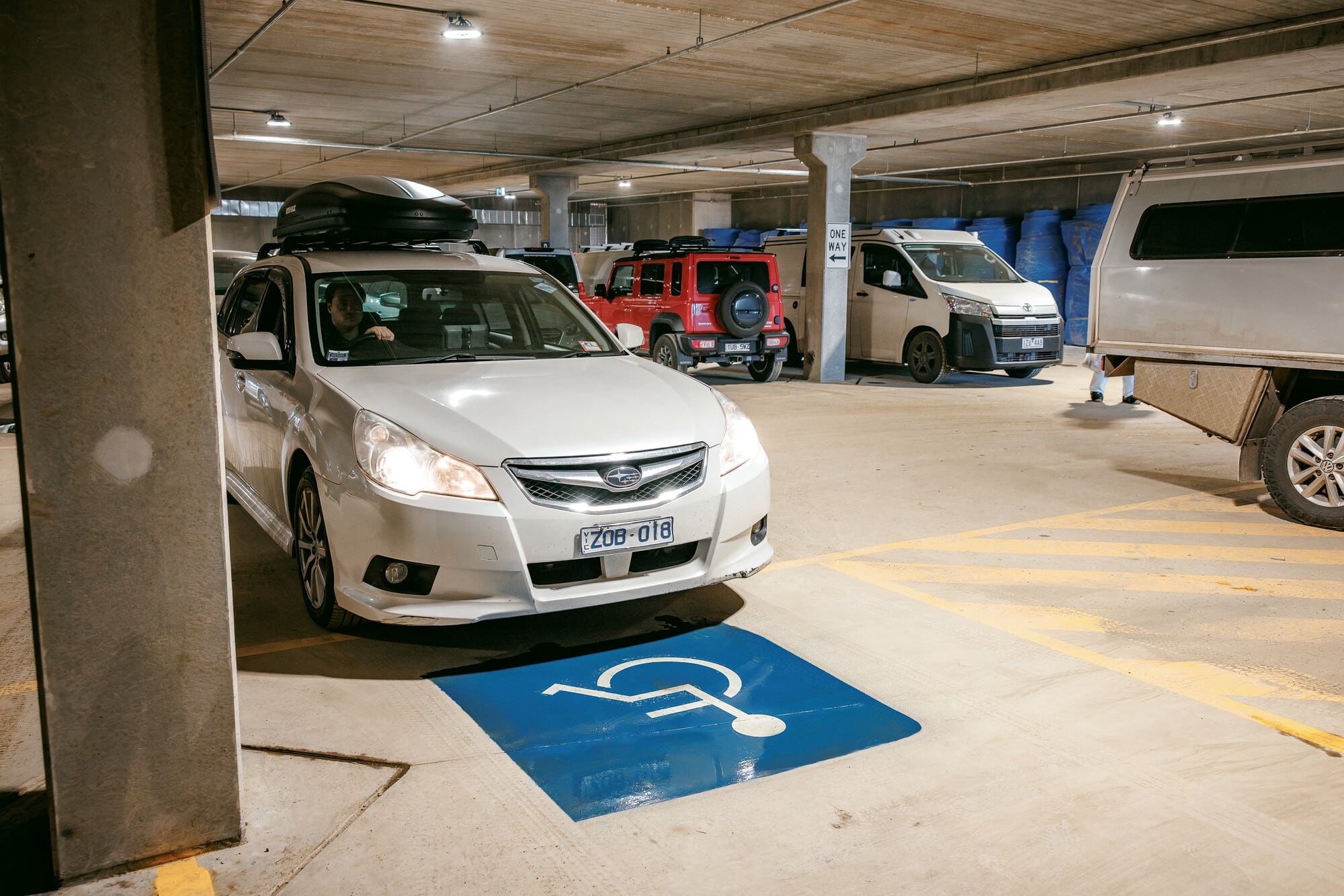 Person parking at the Alpine Gateway Visitor Facility in one of the two designated disabled underground carparks to attend an adaptive guided DWA session.