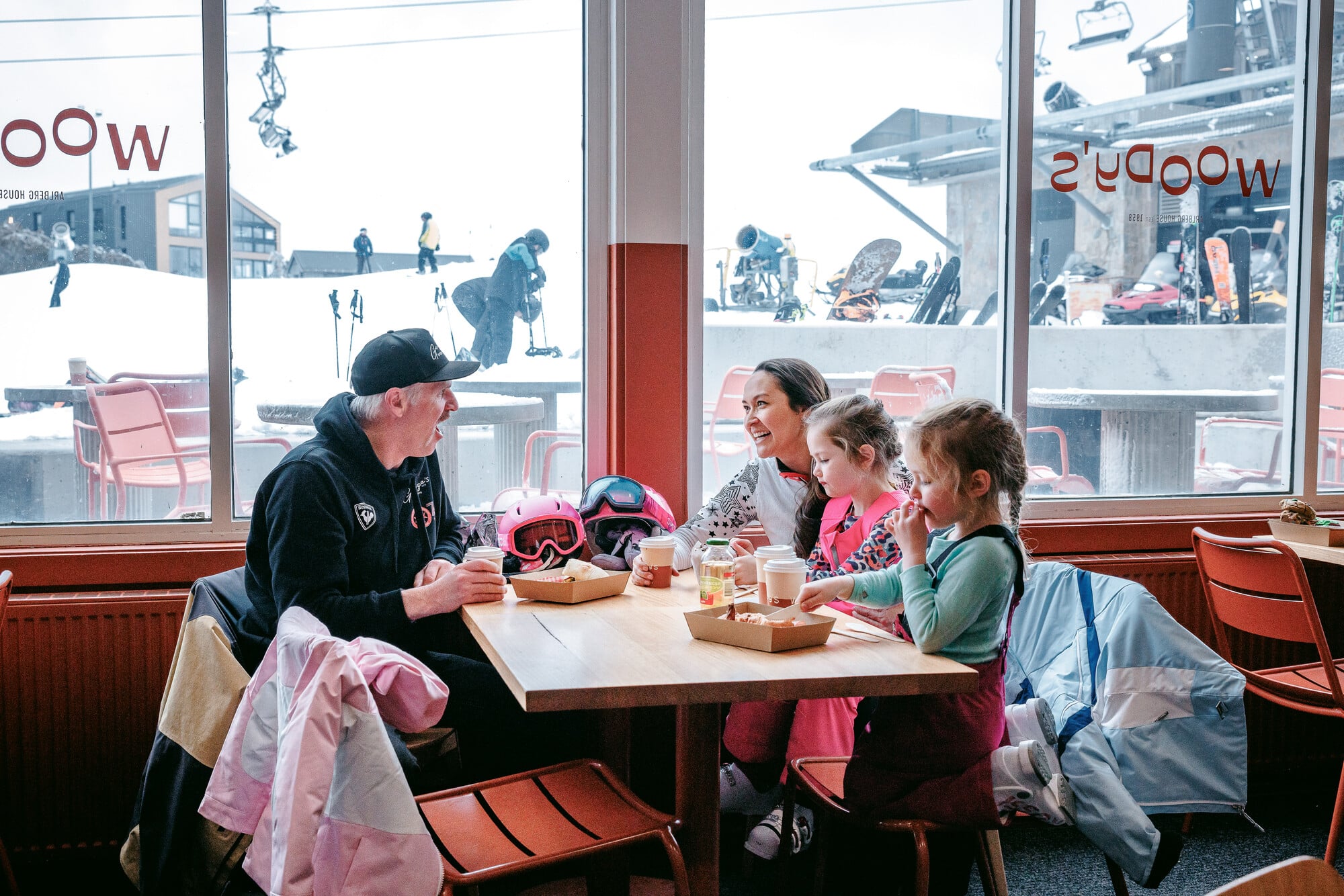 Group of people enjoying hot chocolates and treats at Arlberg House.