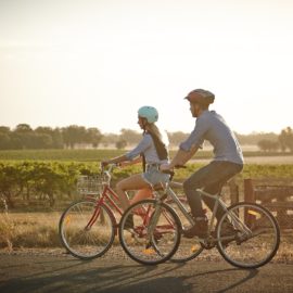 two people riding bikes