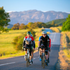 Cycling along Carrolls Road with Mt Buffalo in the background